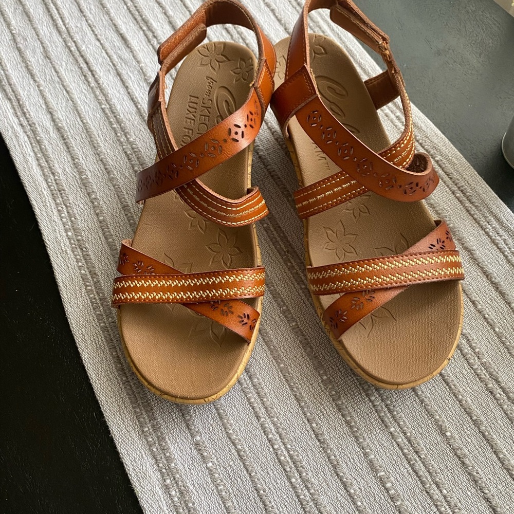 New without box. Sketchers wedge sandals. Size 8.5.